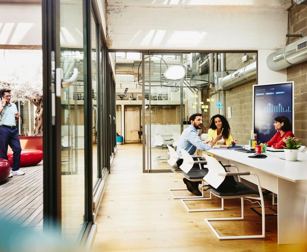 group of employees discussing at work