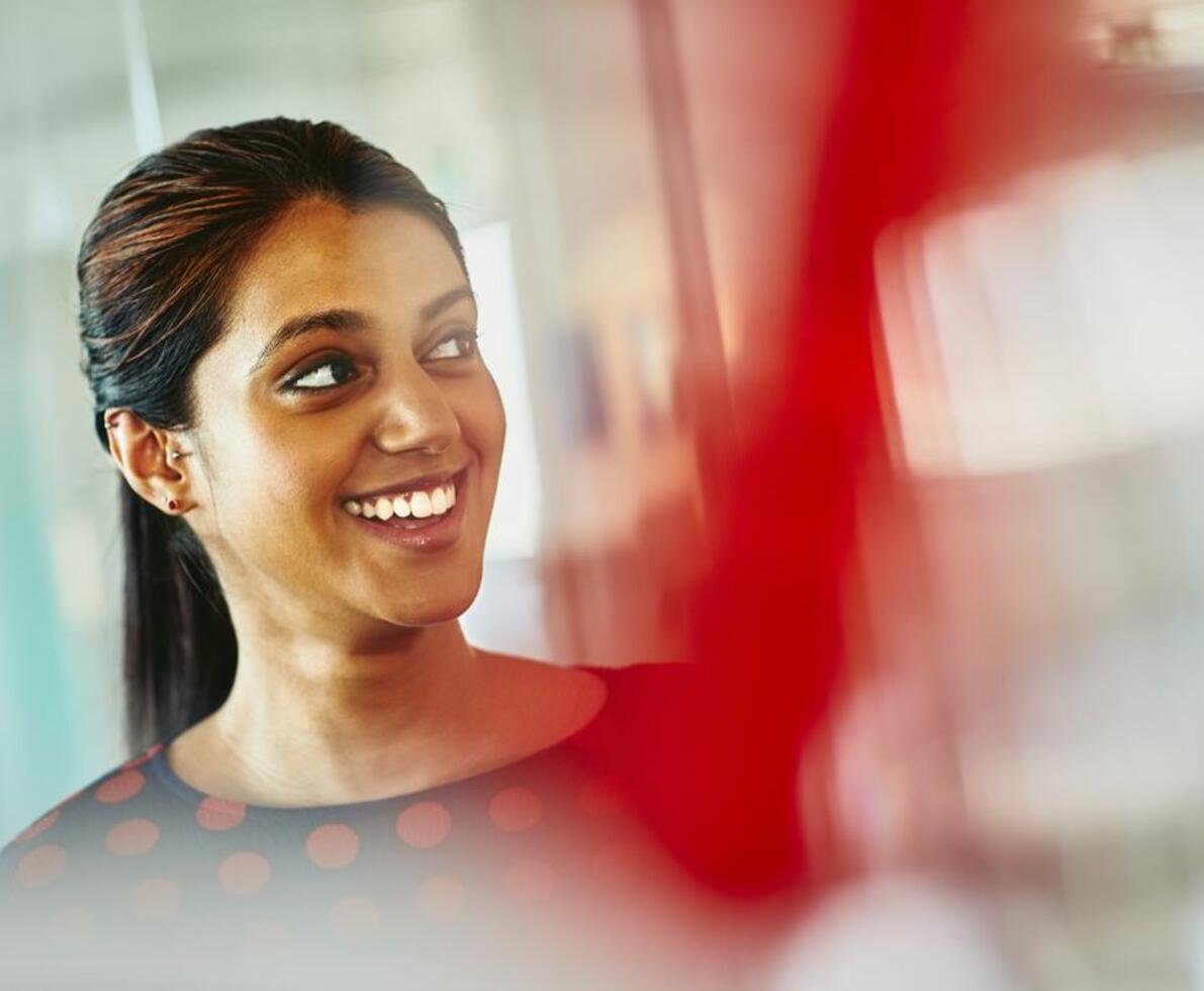 Close up - Smiling woman looking away