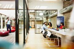group of employees discussing at work