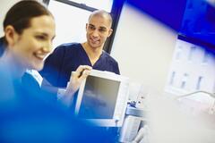 Smiling male nurse working in a hospital