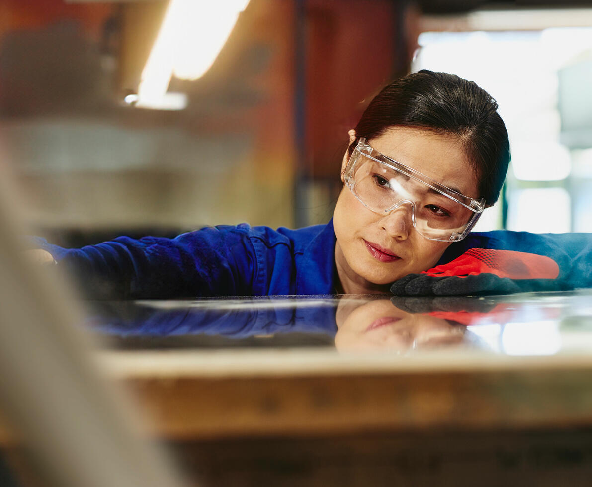A woman wearing protective eye glasses