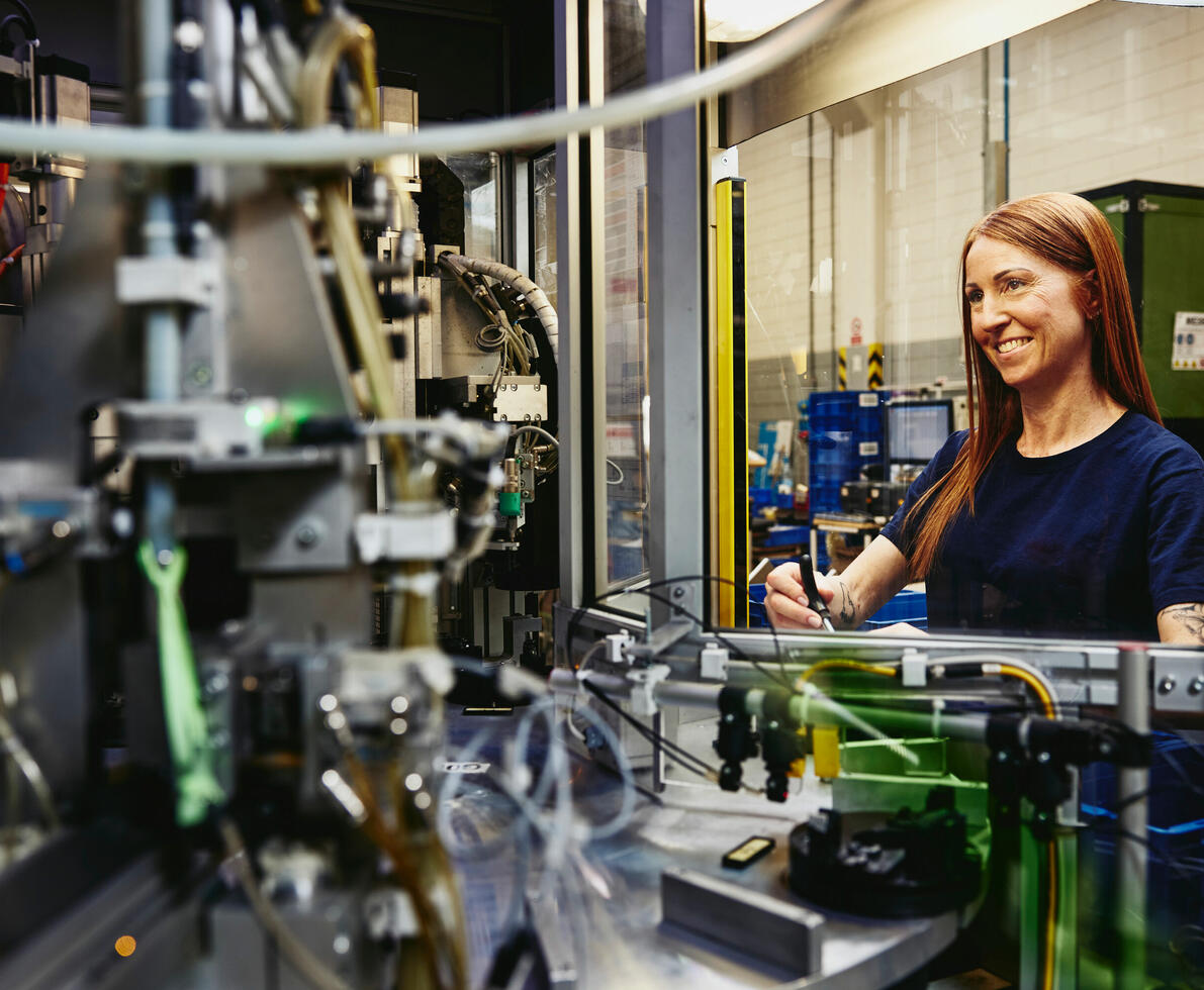 A woman working with machines