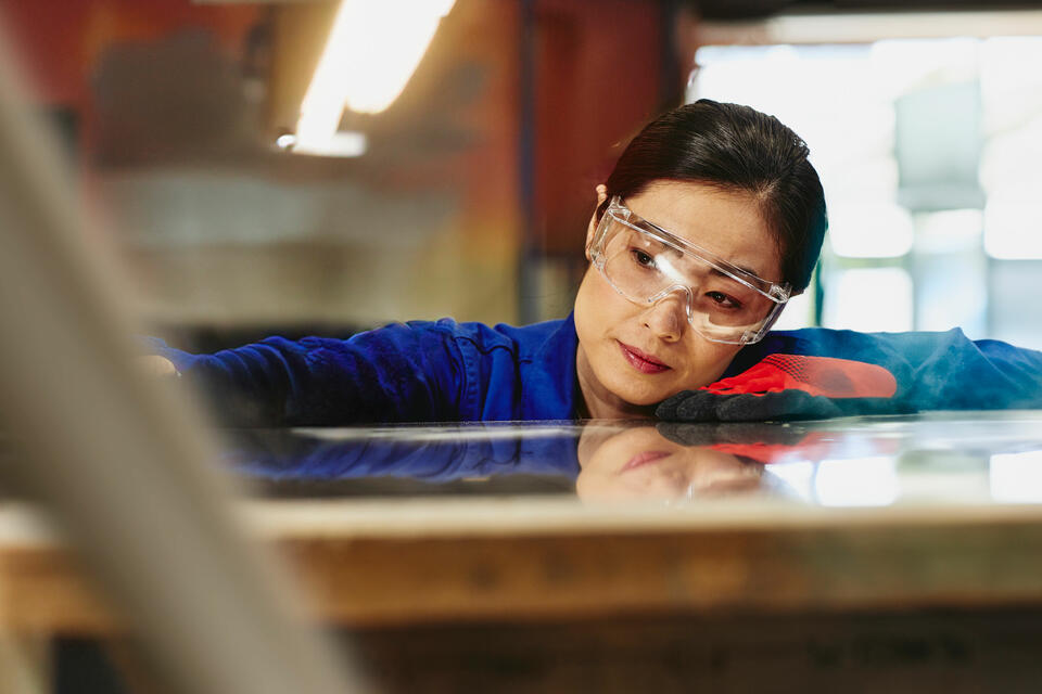 A woman wearing protective eye glasses
