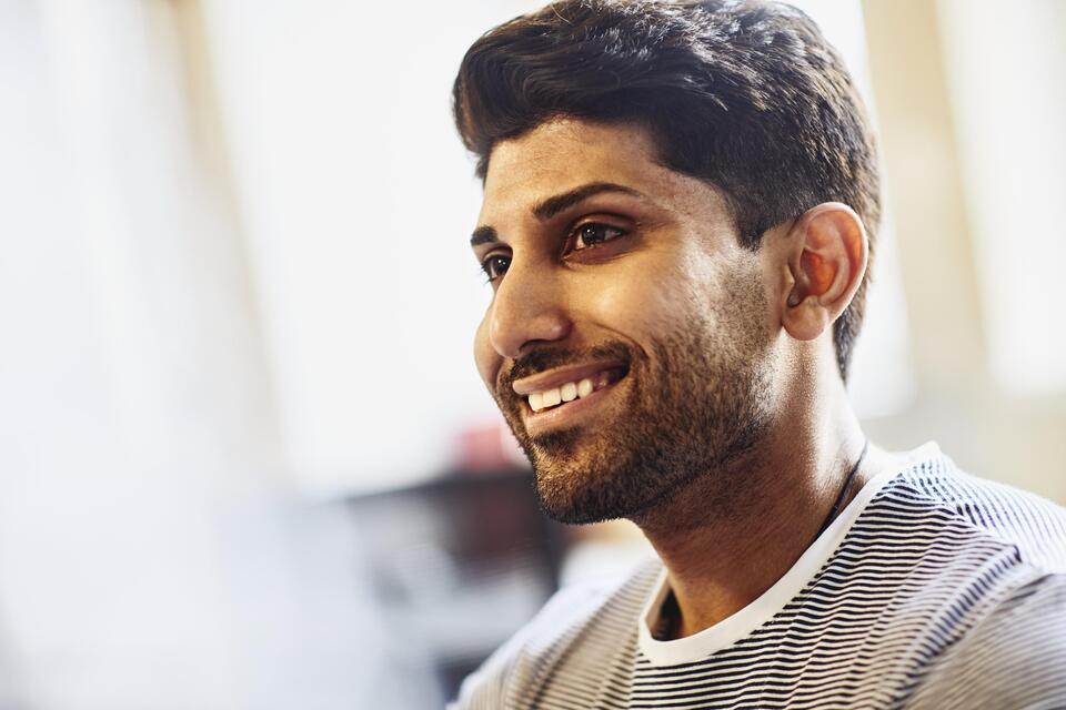 Smiling man in and office Smiling man in and office