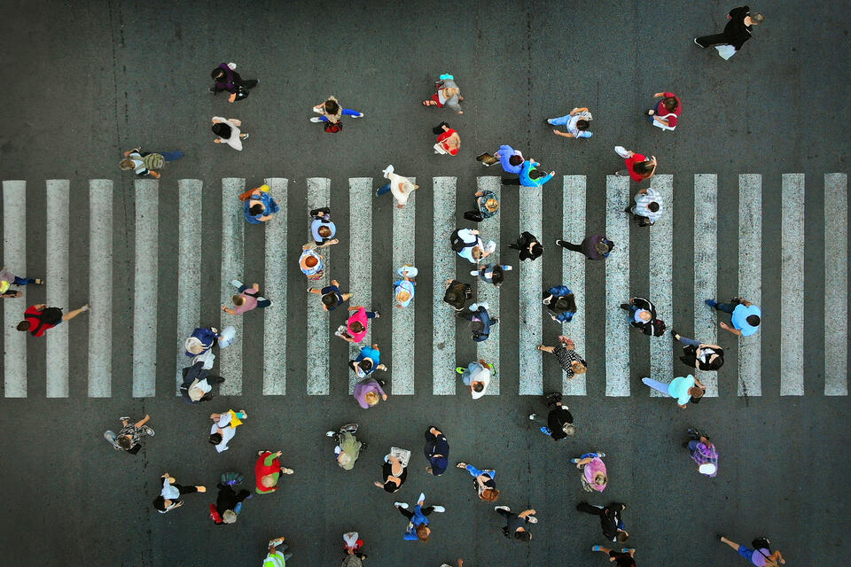 Aerial view of pedestrian crossing a street.